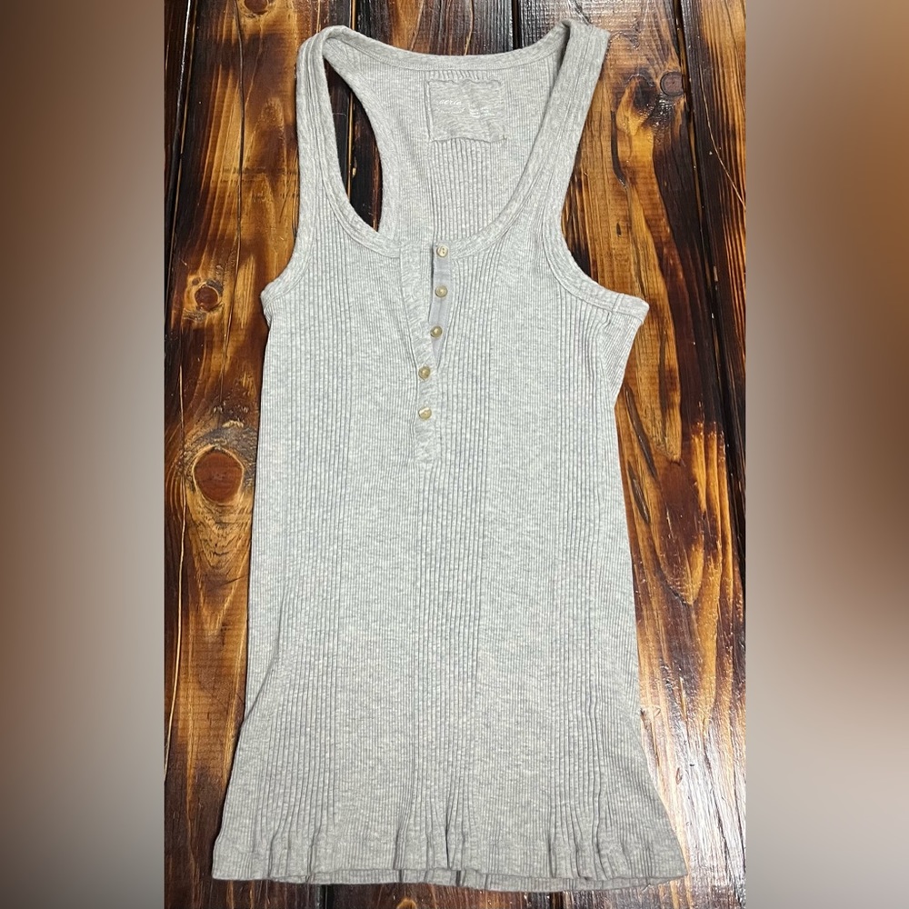 Plain grey ribbed tank top with buttons.